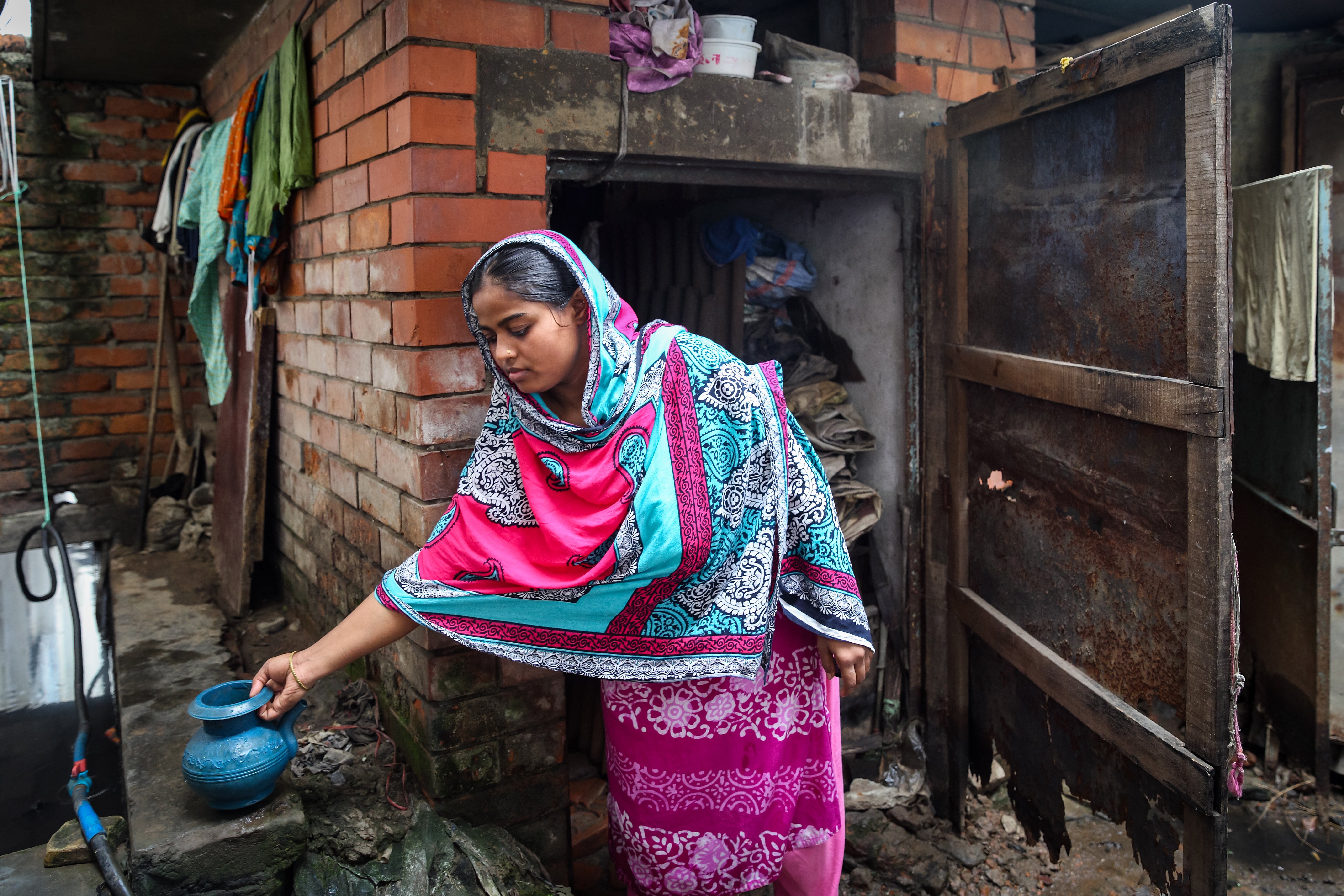 Rasheda and her children at home